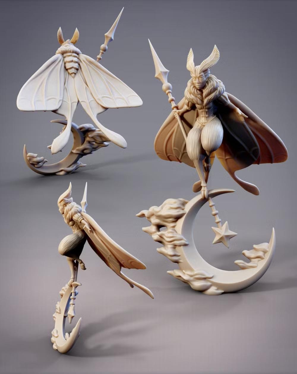 three figurines of fantastical creatures, including a butterfly-like creature, a winged creature with a crescent moon, and a winged creature with a star.