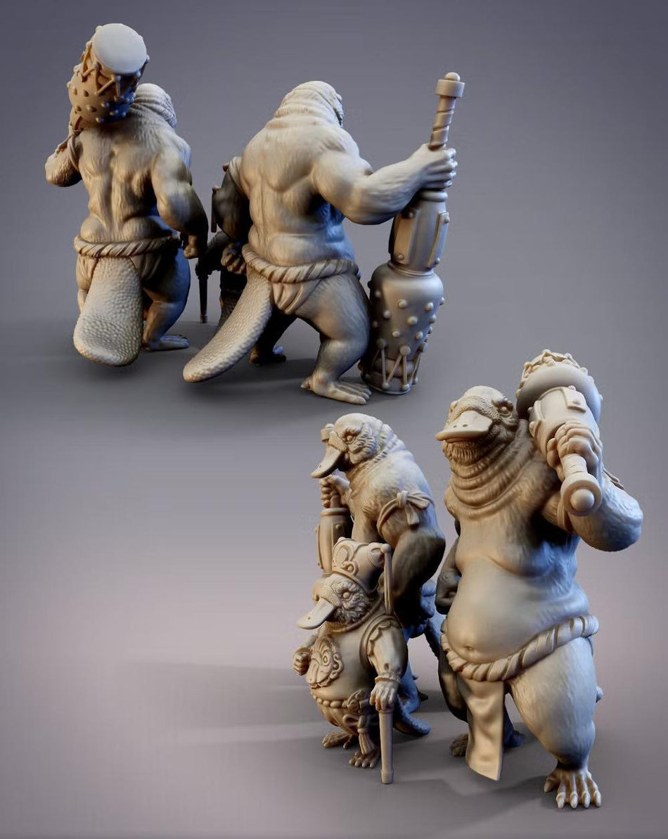 a group of three statues depicting fantastical creatures, including a large, muscular creature with a long tail and a smaller creature with a long neck.