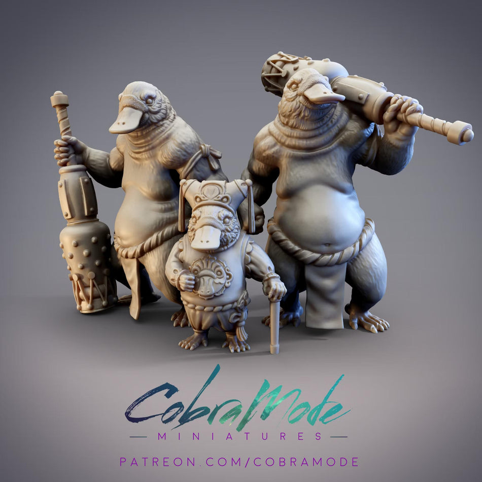 three sculptures of fantastical creatures, including a large, furry creature holding a large object, a smaller creature with a long stick, and a third creature with a large object. The sculptures are arranged in a group, and there is text at the bottom of the image that reads "Cobramode MINIATURES PATRON.COM/COBRAMODE".